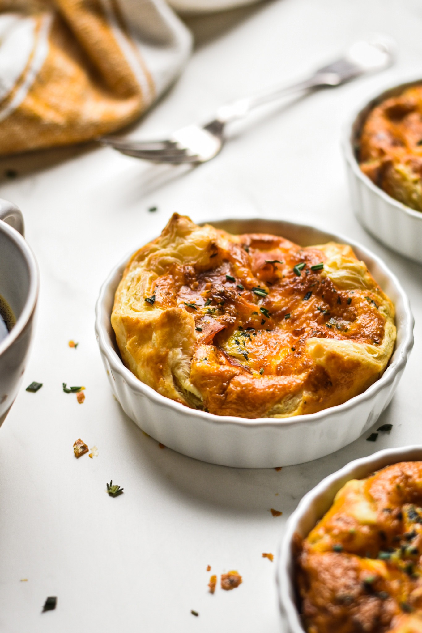 Side view of a panera style souffle in a white ramekin.