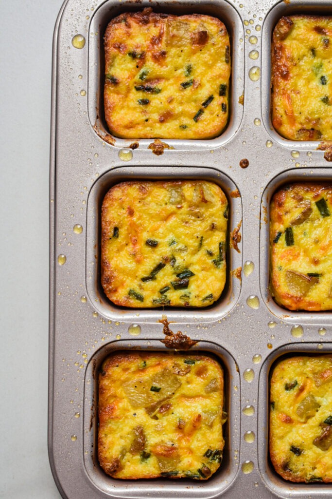 Baked Starbucks potato cheddar and chive bakes in a brownie cake pan.