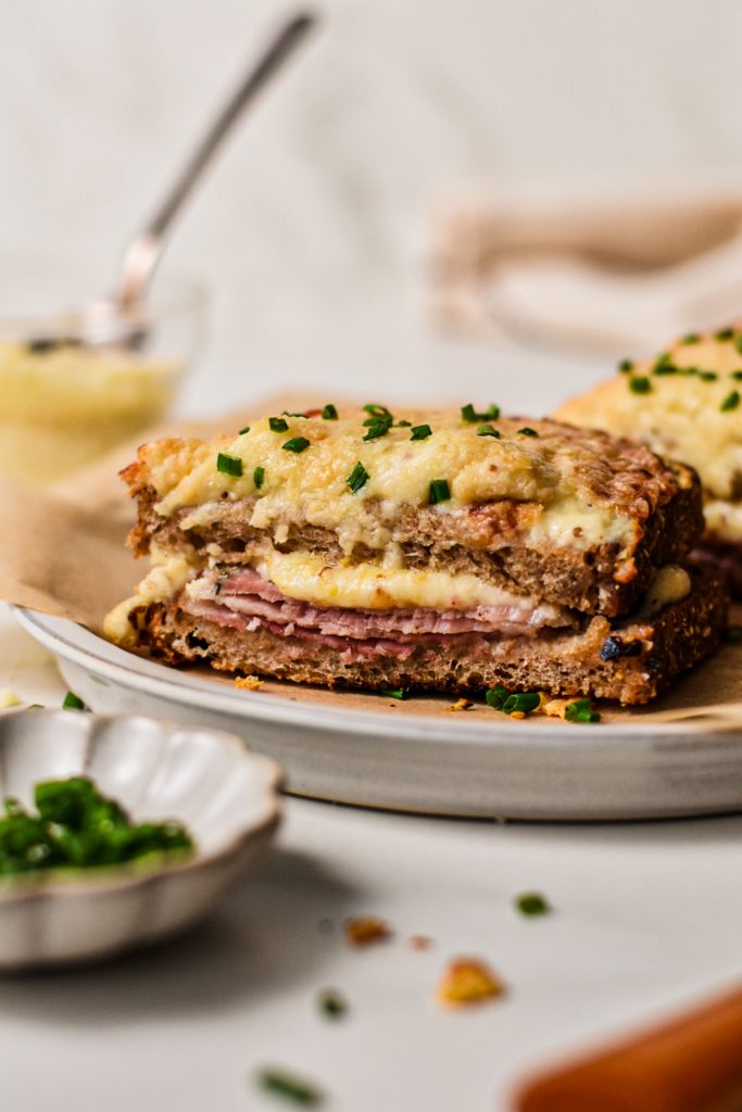 Side view of the croque monsieur on a plate.