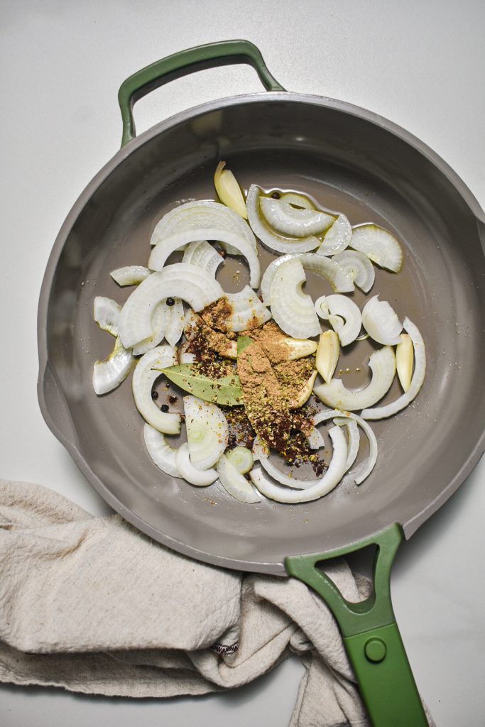 Onions, garlic and spices in a skillet.