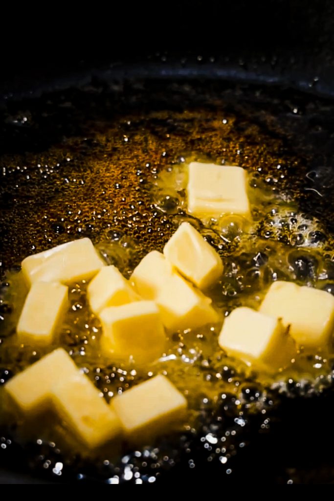 Butter and sugar in a cast iron skillet.