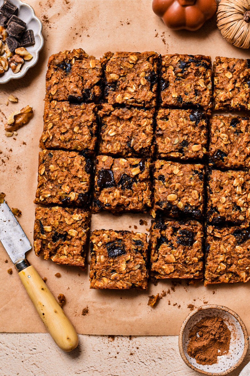 Overhead shot of pumpkin chocolate baked oats sliced into squares.