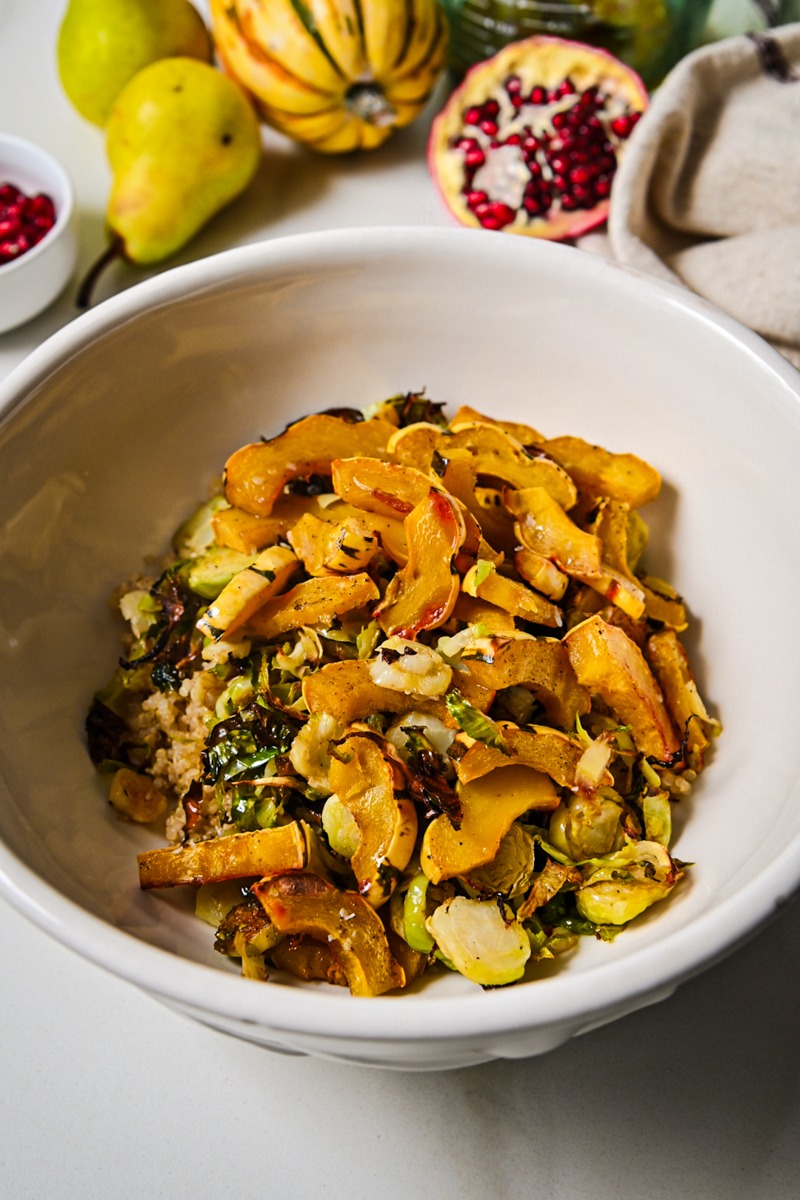 Roasted squash, brussels sprouds and quinoa in a bowl.