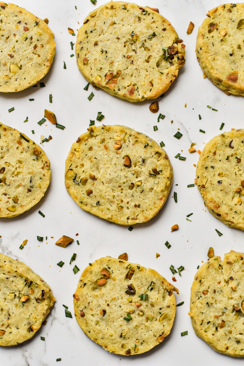 Baked savory shortbread lined up on a counter.