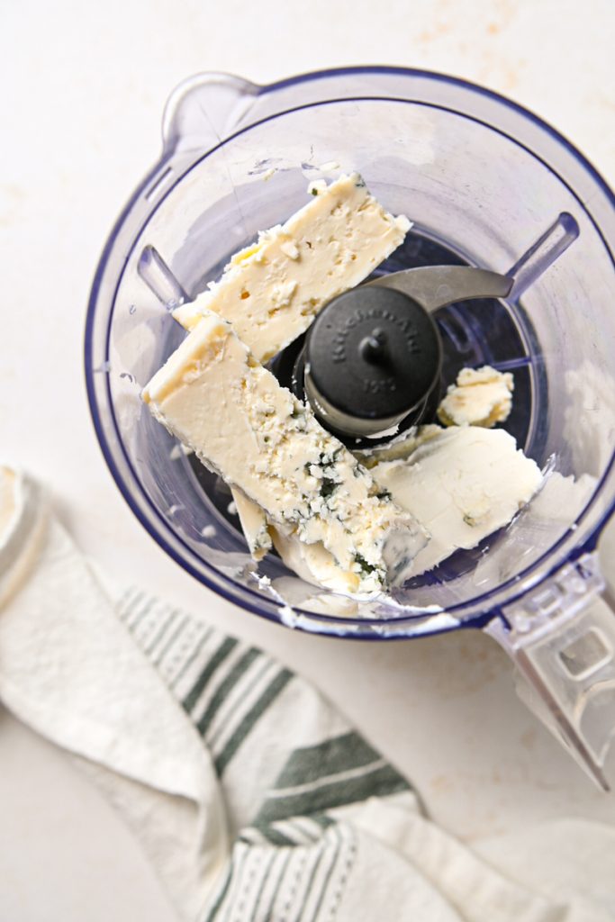 Gorgonzola and cream cheese in a food processor.