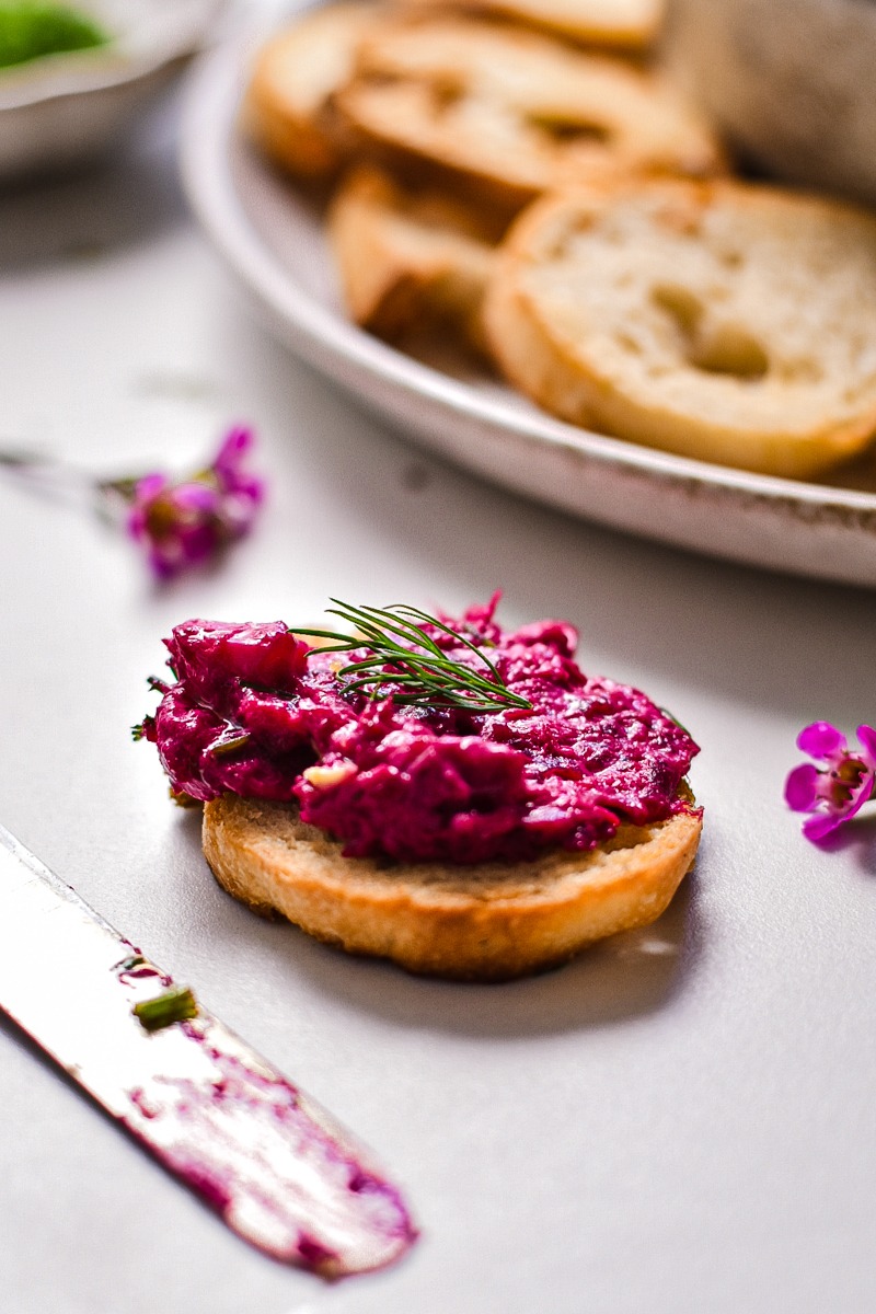 Beetroot and tuna dip served on a small crostini.