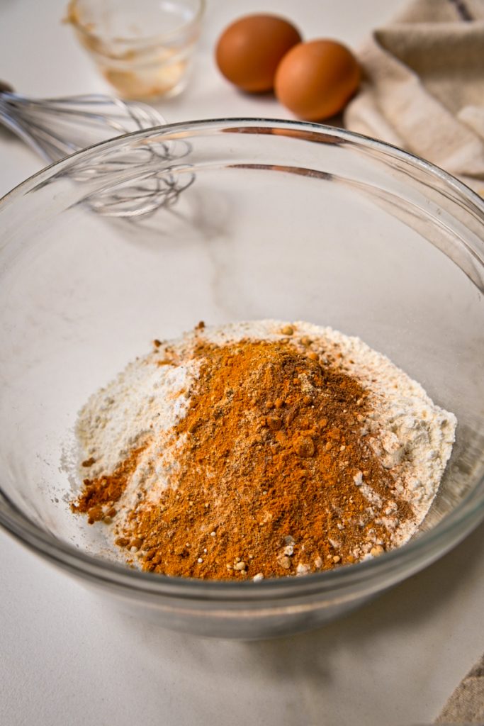 Dry ingredients for golden milk banana bread in a mixing bowl.