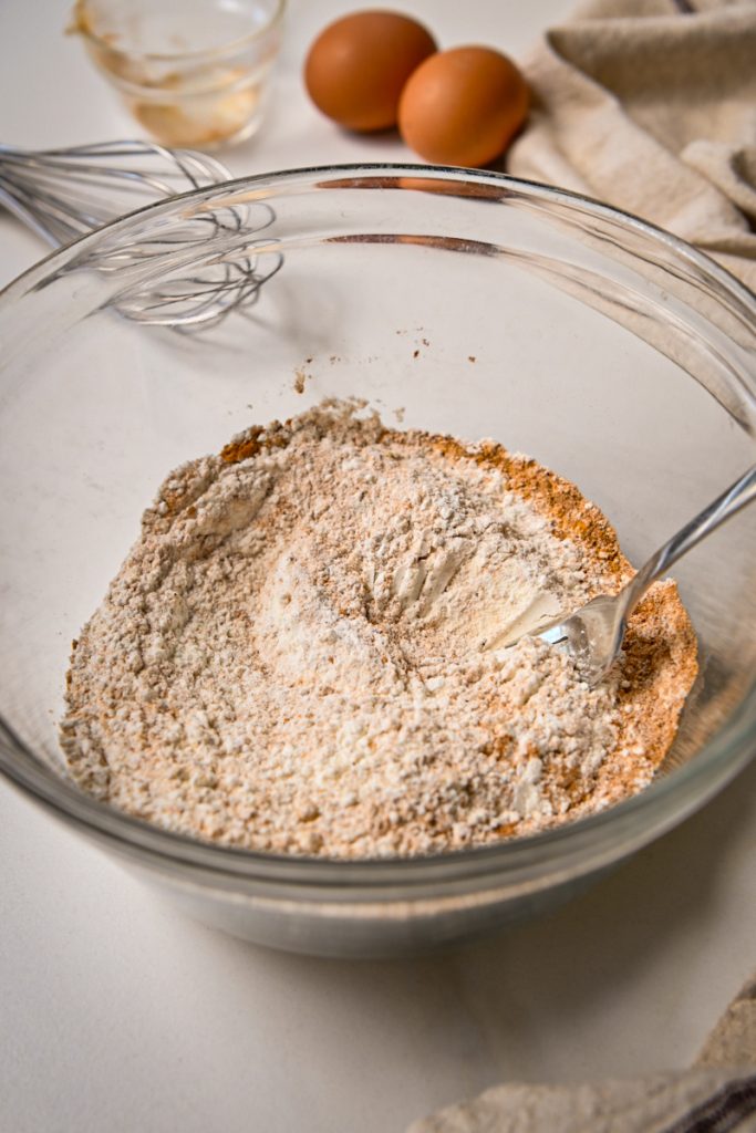 Dry ingredients whisked together in a mixing bowl.
