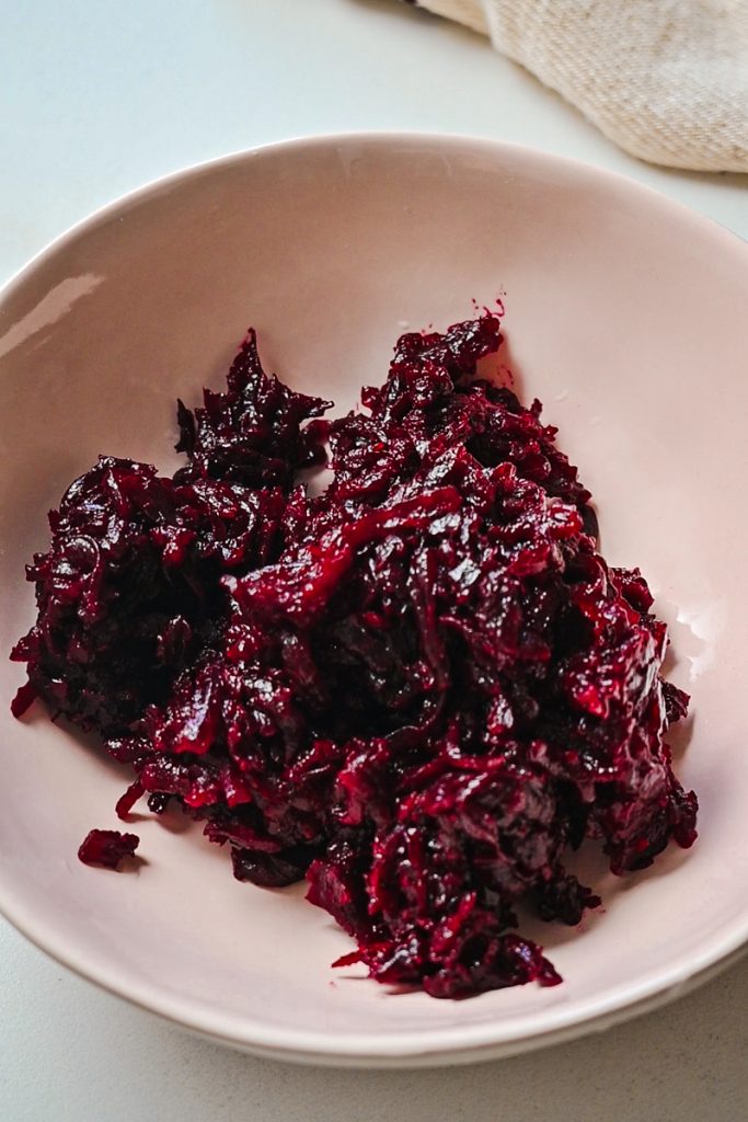 Shredded beets in a bowl.
