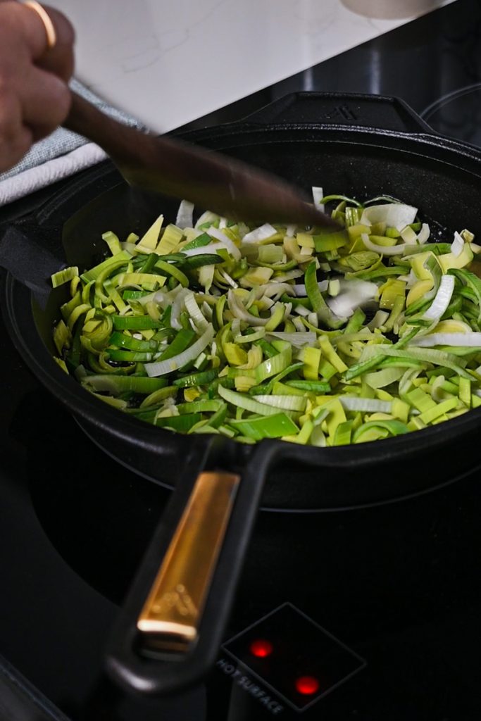 Sautéing leeks in a skillet.