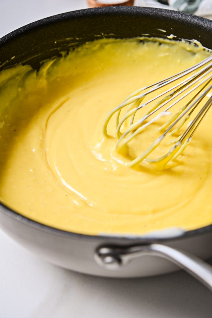 Bechamel sauce in a skillet after all the egg yolks are mixed in.