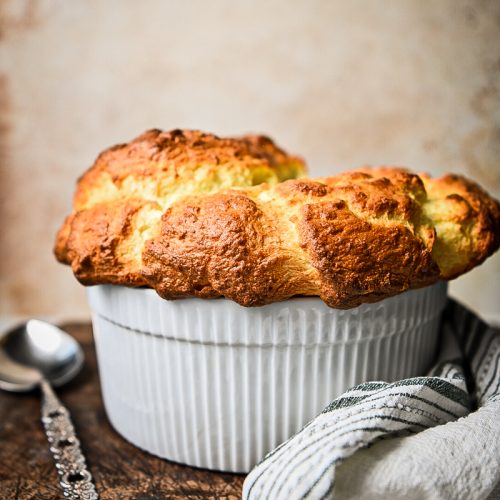 Side view of a classic French cheese souffle after being baked.