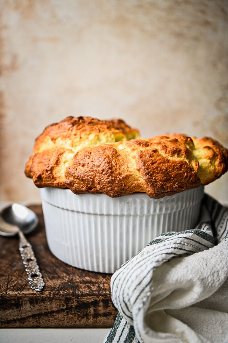 Side view of a classic French cheese souffle after being baked.