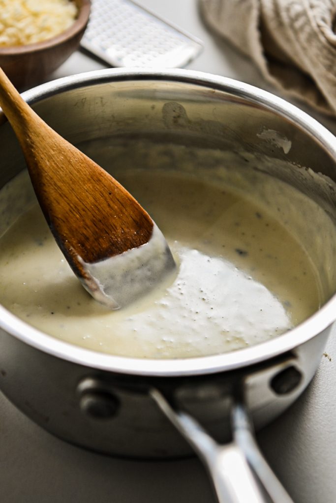 Gorgonzola and heavy cream melted together in a saucepan.