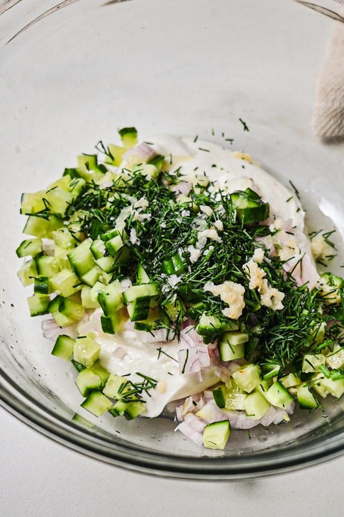 Smashed chickpea salad dressing ingredients in a bowl before mixing together.