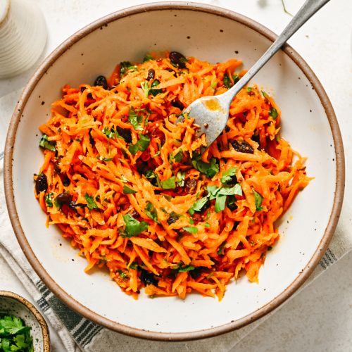 Finished Moroccan carrot salad in a bowl.
