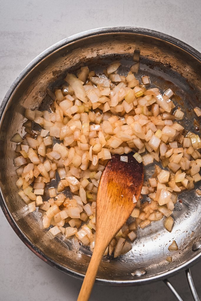 Image of sauteing onion in a skillet.