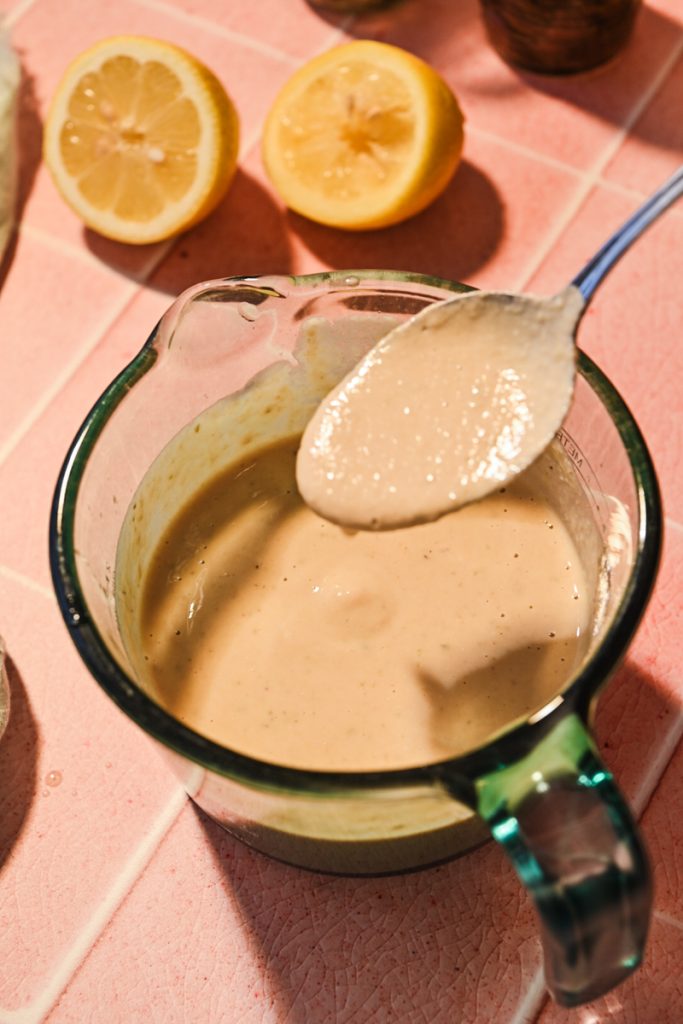 Tonnato sauce in a measuring cup after being blended.