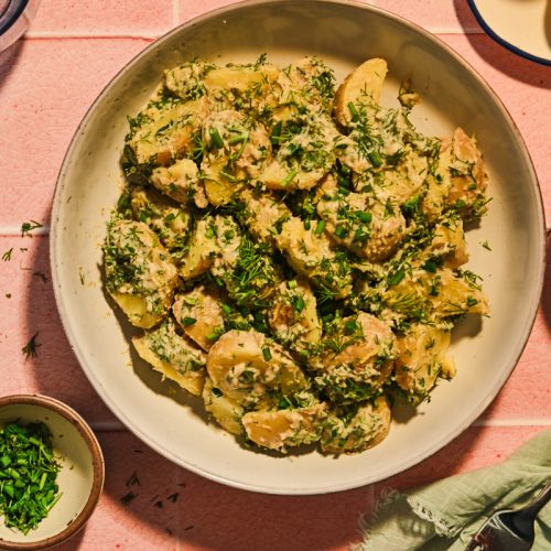 Overhead shot of tonnato potato salad in a bowl.