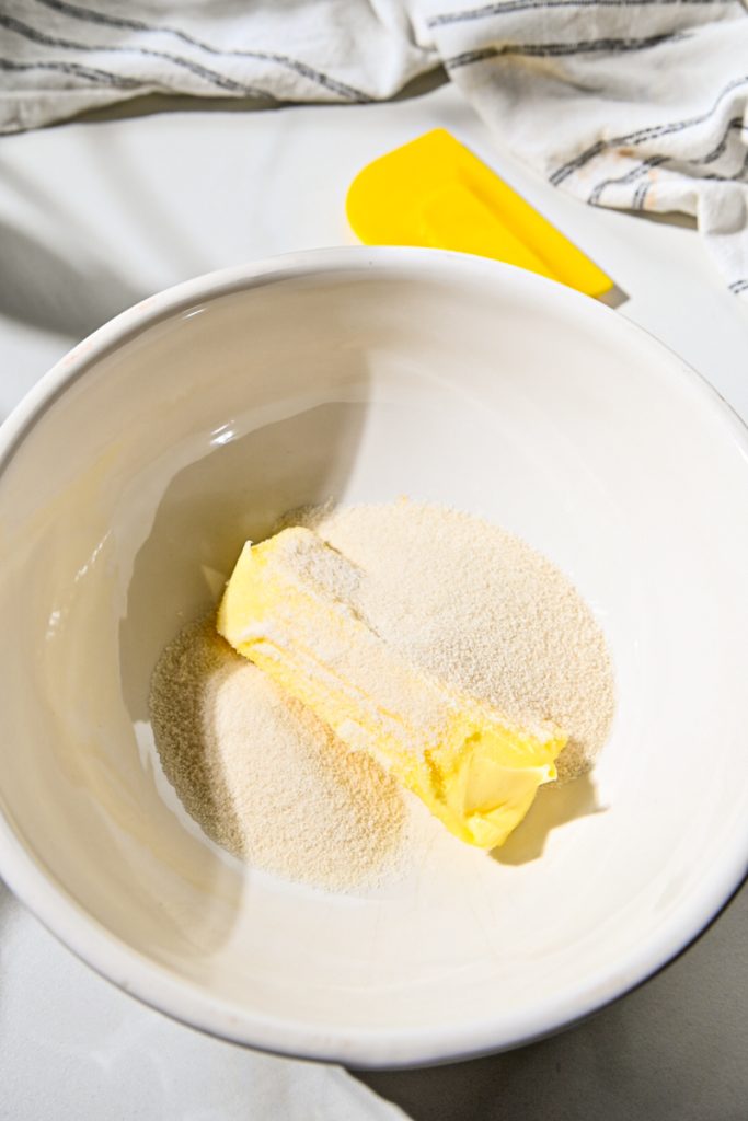 Softened butter and sugar in a mixing bowl.
