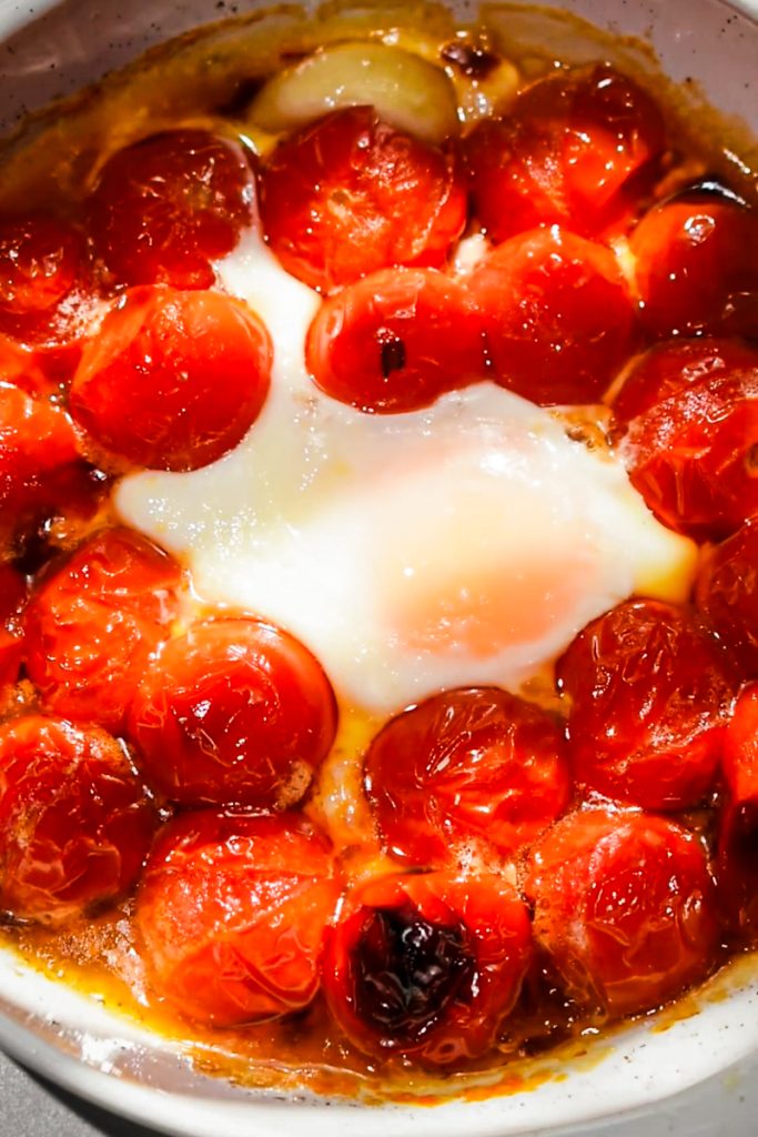 Finished eggs in purgatory in a small baking dish.