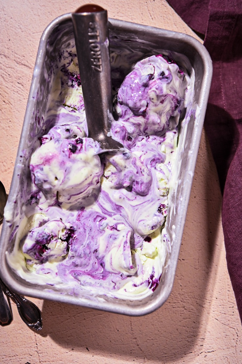Overhead shot of blueberry basil ice cream in a loaf pan.