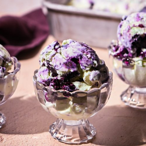 Glass cup served with blueberry basil ice cream.
