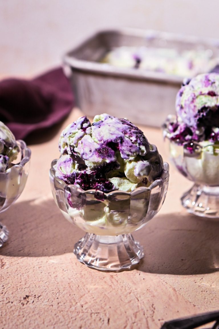 Glass cup served with blueberry basil ice cream.