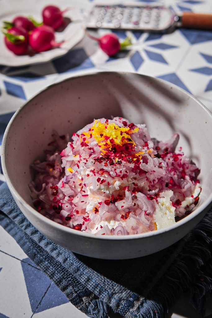 Radishes, shallots, pink peppercorns and lemon zest added to the whole milk ricotta.