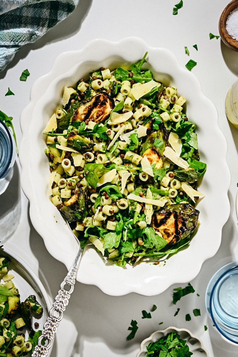 Zucchini pasta salad served in a white serving bowl.