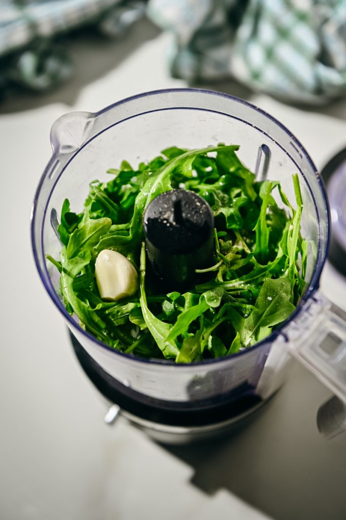 Arugula, garlic, lemon juice, olive oil and spices in a food processor.