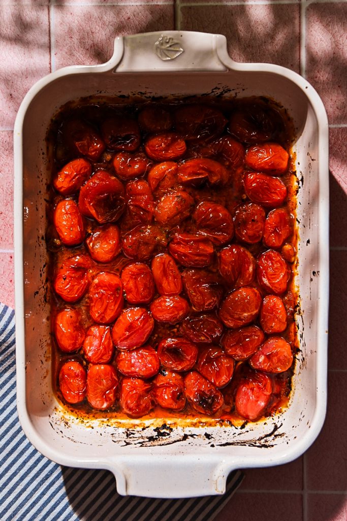Tomatoes in a baking dish after being roasted.