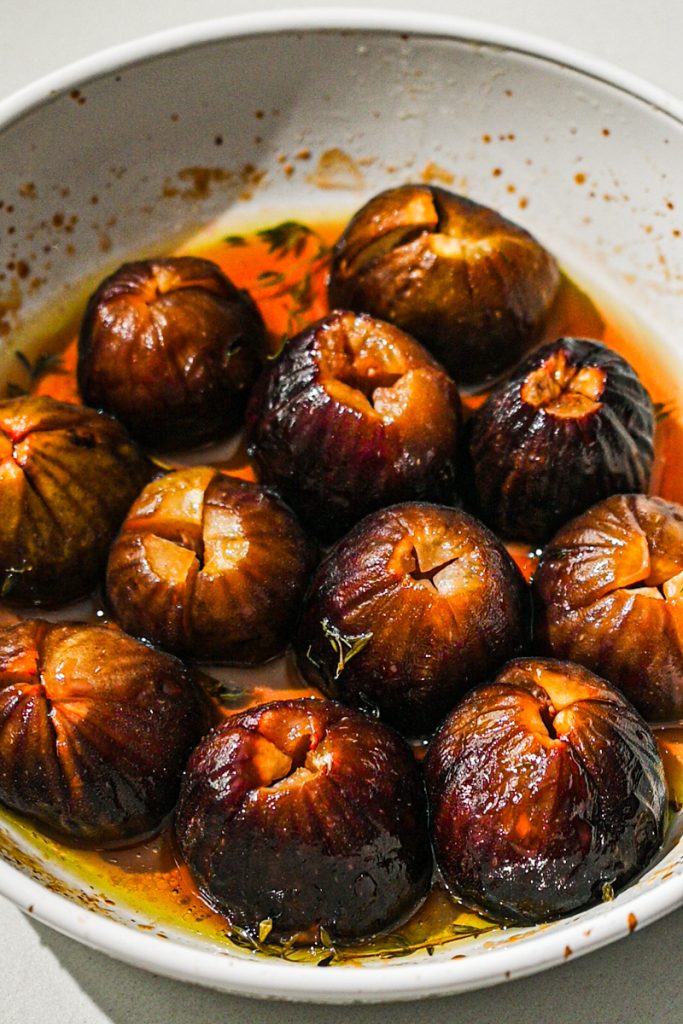Roasted figs in a baking dish.