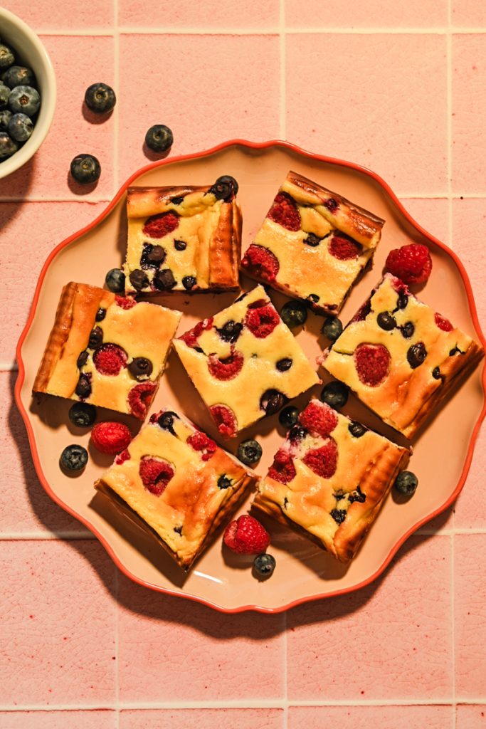 Top view of Crustless Yogurt Cheesecake Bars with Berries