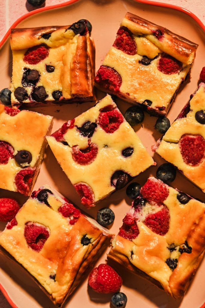 Top view of Crustless Yogurt Cheesecake Bars with Berries