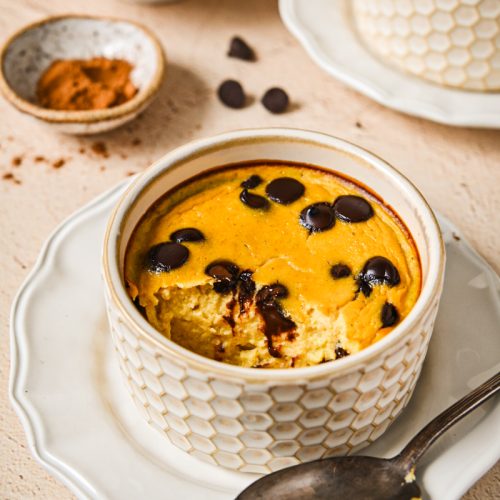 Baked pumpkin banana yogurt in a ramekin with golden top and melted chocolate chips